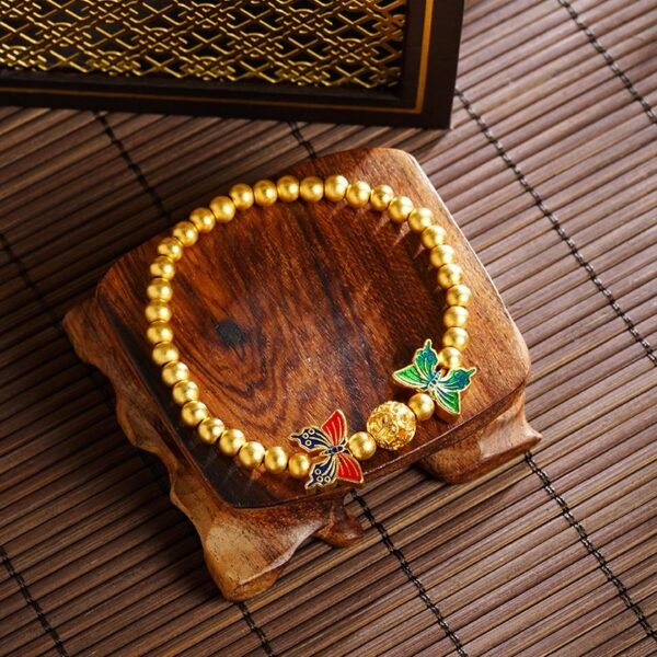 buddhaobject-Golden Butterfly & Hydrangea Charm Bracelet-2 Golden Butterfly & Hydrangea Charm Bracelet – Sand-Gold Beaded Design