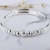 Nine Turn Fortune Bead Silver Plated Copper Bangle